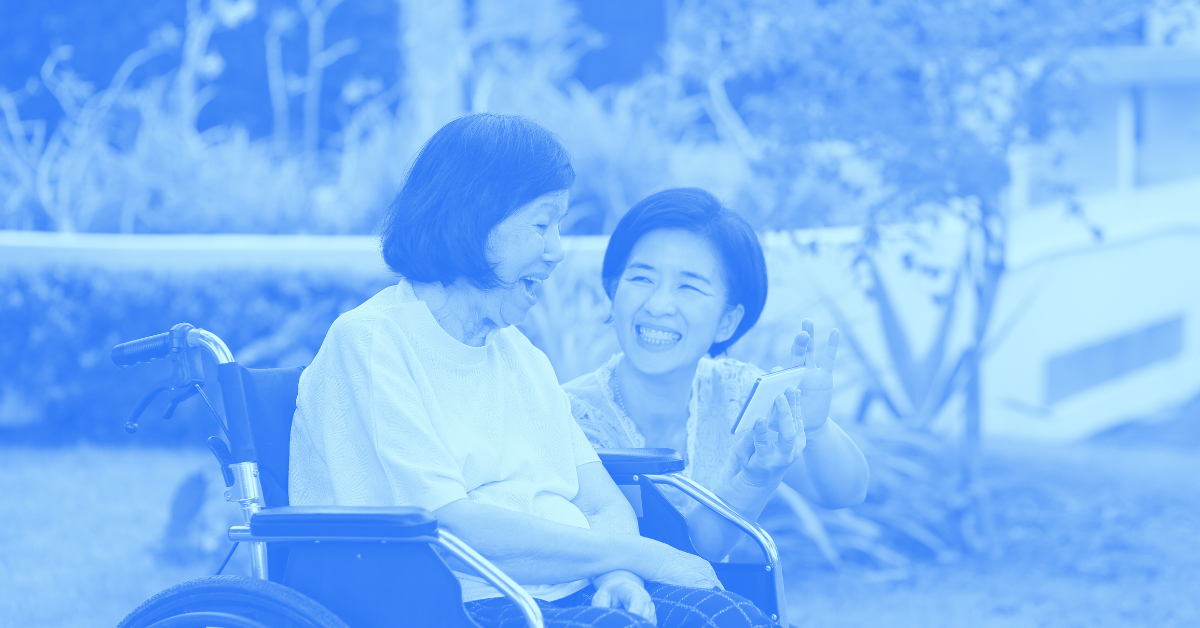 Daughter spending quality time with her mother, who's sitting in a wheelchair