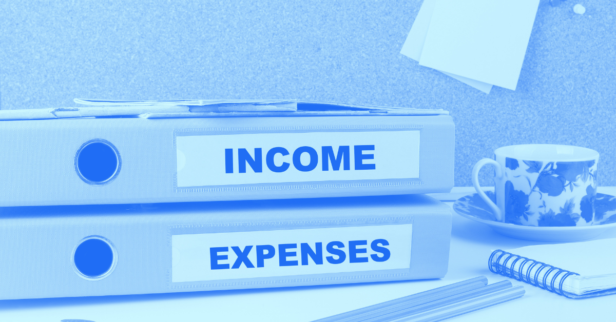 Two binders stacked on top of each other, income and expenses